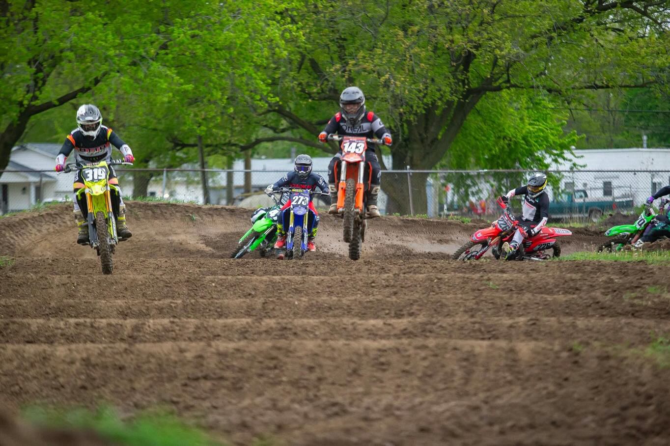 May be an image of 3 people and dirt bike